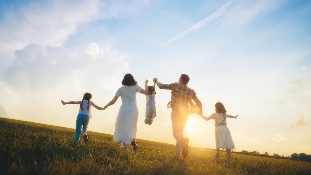 Family walking together in a sunlit field — quality of life and care