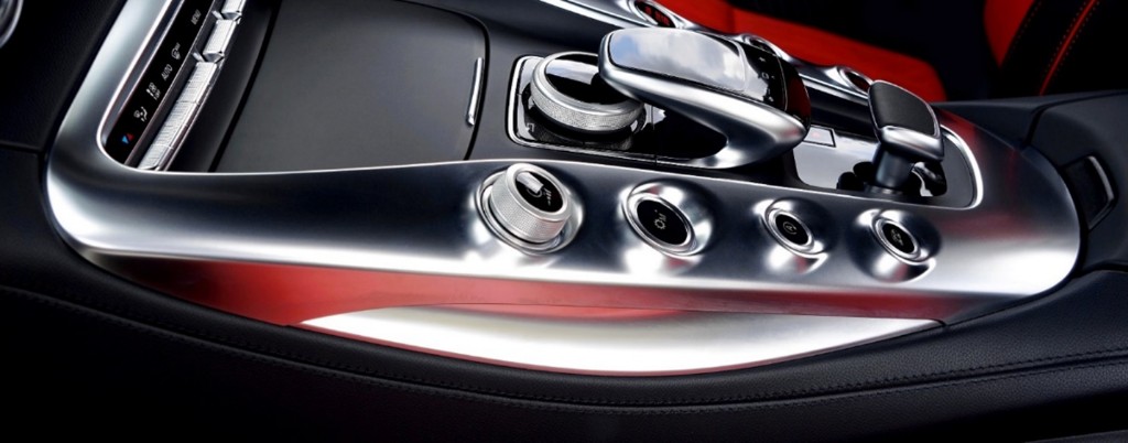 Aluminum console surround with precision-machined controls