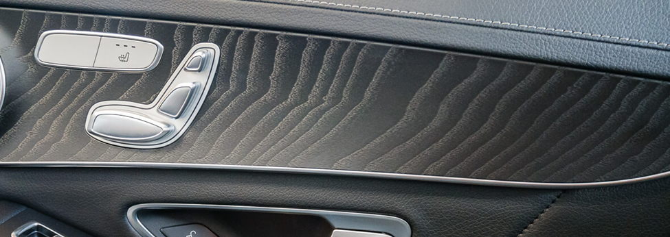 Open-pore wood grain decorative panel on a door trim